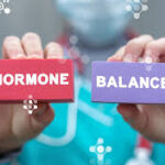 Woman in reclined butterfly pose to relieve PMS and menstrual discomfort