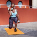 Beginner lifting dumbbells in a gym setting