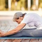 Person in restorative yoga pose with props to ease arthritis inflammation