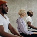 professional woman practicing mindful breathing yoga at her desk