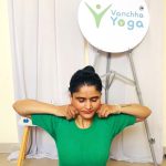 Woman massaging face during yoga skincare routine