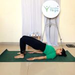Mother meditating during postnatal yoga practice